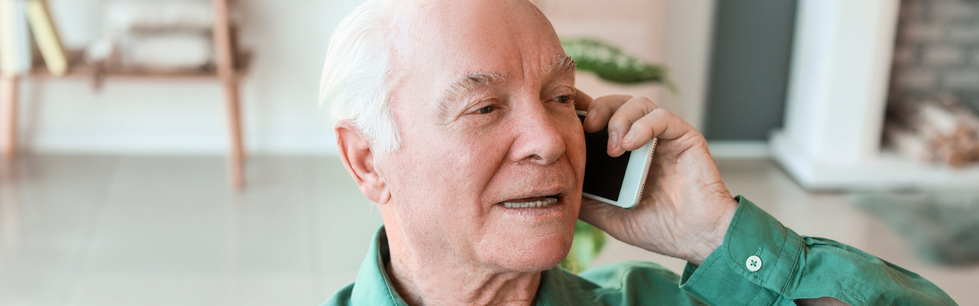 elderly man talking on phone